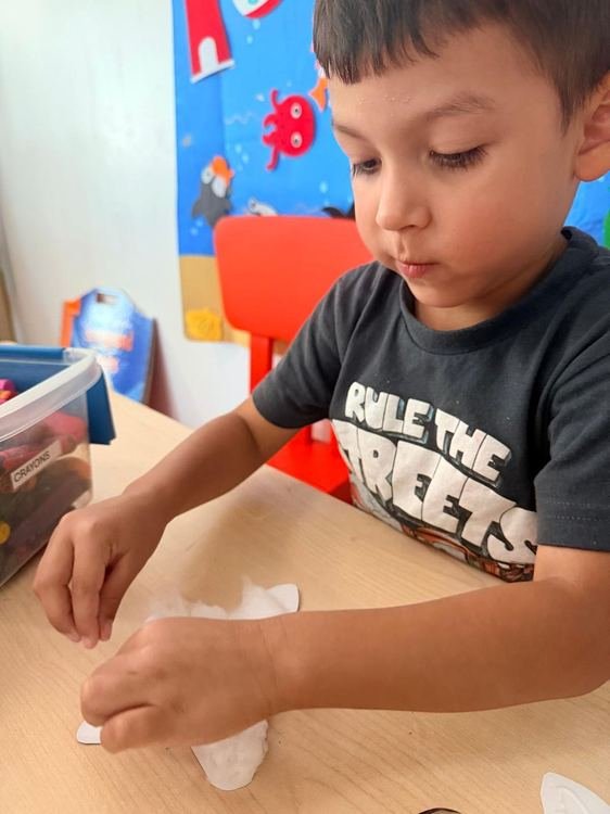 A boy working on a craft activity