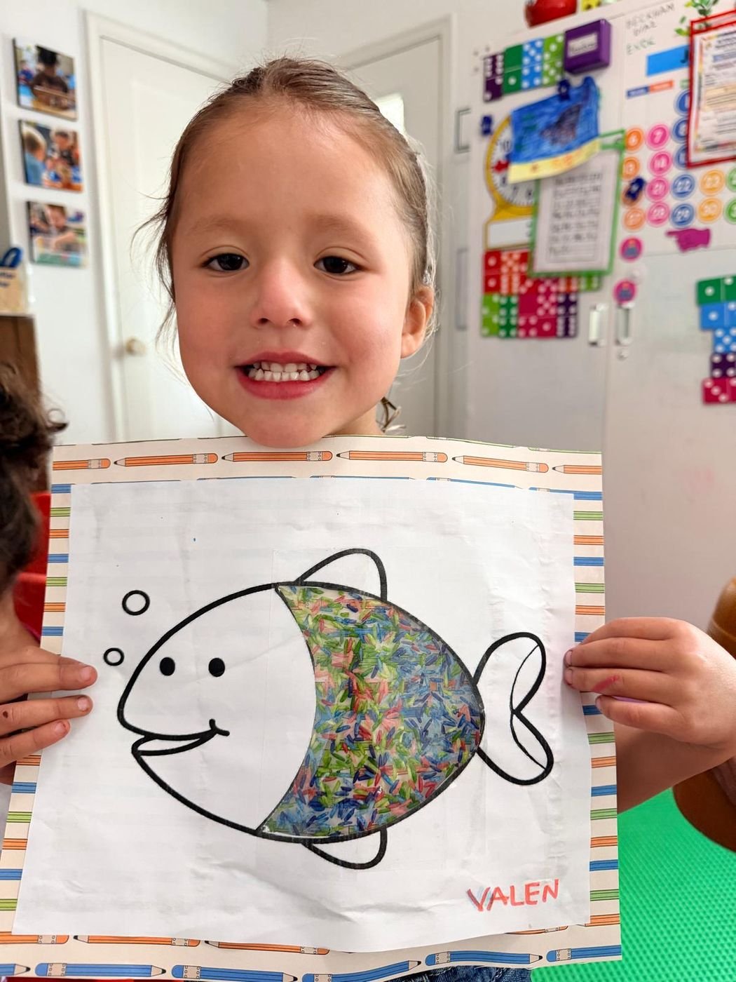 A preschool girl smiling at Aby Early Learning Center